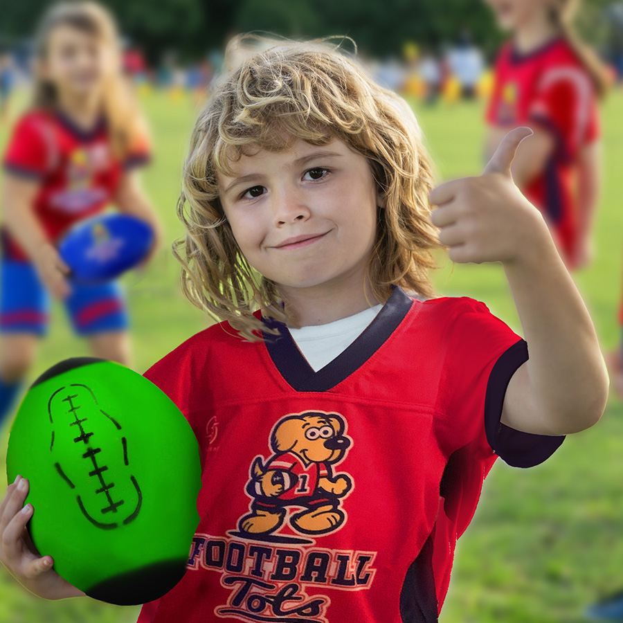 Young boy giving FootballTots football classes the thumbs up!
