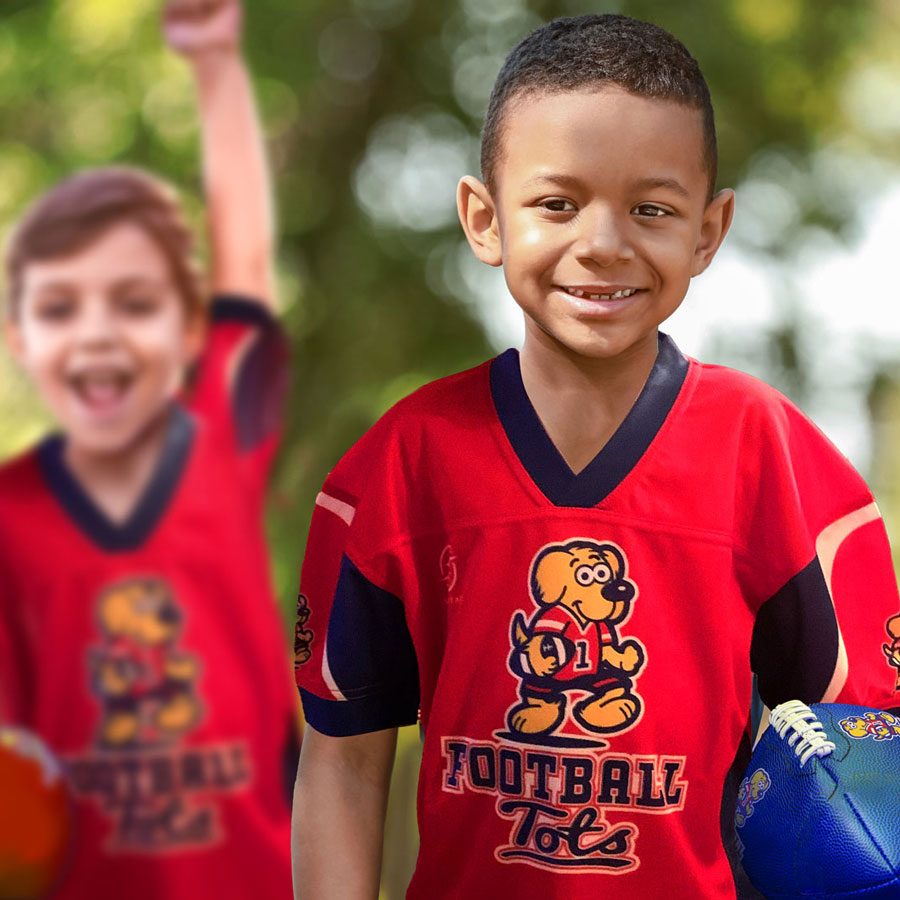 Children with footballs in a FootballTots class